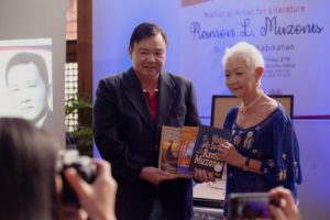 Mayor Jerry Treñas receiving three Ramon Muzones books from Dr. Cecilia Locsin-Nava.