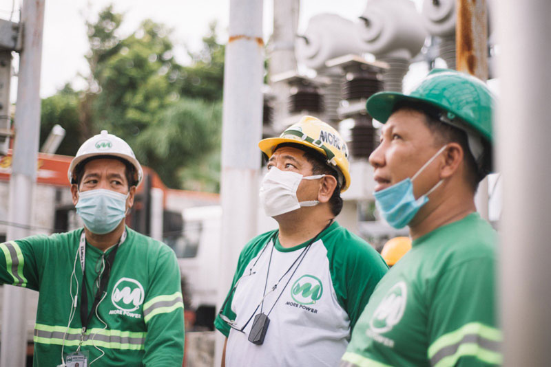 Roel Z Castro together with MORE Power engineers during the launch of 69kV switching station at Banuyao, Lapaz.