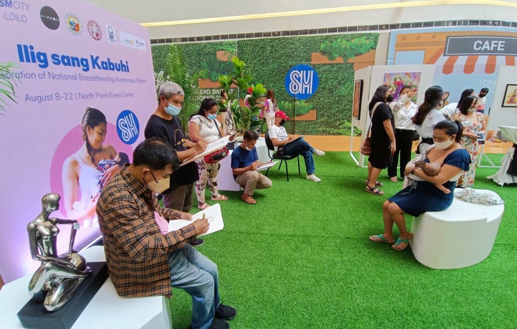 Himbon artists do on-the-spot sketching of breastfeeding mothers at the opening of "Ilig Sang Kabuhi" art exhibit in SM City Iloilo.