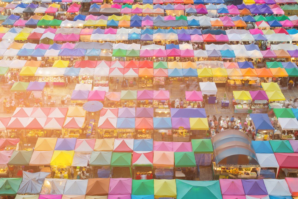 World-famous Chatuchak Market’s top view with stalls in multiple colors.